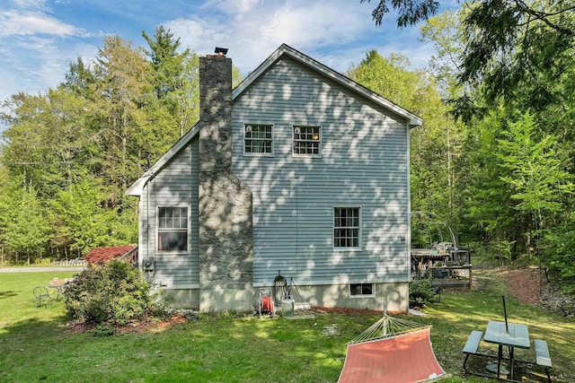 93 Birch Rd, Chester, NH 03036 - view of property exterior with a yard, a chimney, and a wooden deck