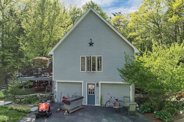 93 Birch Rd, Chester, NH 03036 - view of home's exterior featuring a wooden deck and a garage