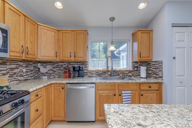 4 Lancer Ln, Danville, NH 03819 - kitchen with stainless steel appliances, backsplash, light stone countertops, decorative light fixtures, and recessed lighting
