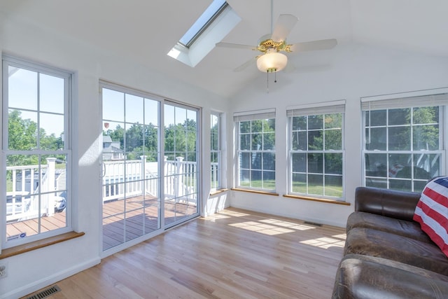 4 Lancer Ln, Danville, NH 03819 - sunroom / solarium featuring vaulted ceiling, plenty of natural light, wood finished floors, a skylight, and a deck
