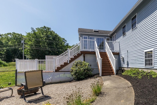 4 Lancer Ln, Danville, NH 03819 - back of house featuring stairs and a wooden deck