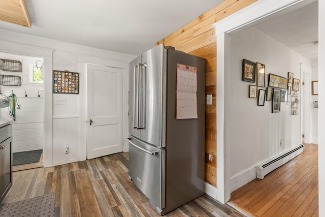 71 Hill St, Dover, NH 03820 - kitchen with freestanding refrigerator, a baseboard heating unit, and wood-type flooring
