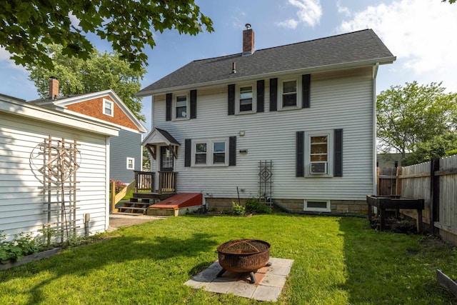 71 Hill St, Dover, NH 03820 - back of property featuring a chimney, a fire pit, and cooling unit