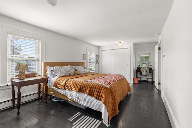 71 Hill St, Dover, NH 03820 - bedroom featuring dark wood-style floors, baseboard heating, and a closet