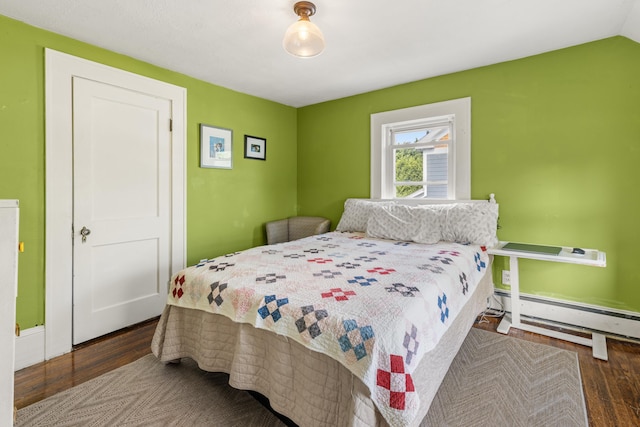 71 Hill St, Dover, NH 03820 - bedroom featuring baseboard heating and wood finished floors