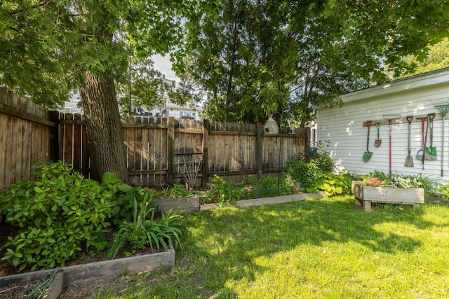71 Hill St, Dover, NH 03820 - fenced yard featuring a garden