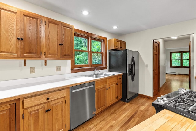 147 Durham Point Rd, Durham, NH 03824 - kitchen featuring stainless steel appliances, light wood-style flooring, light countertops, a baseboard heating unit, and recessed lighting