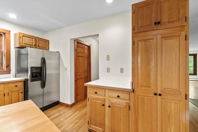147 Durham Point Rd, Durham, NH 03824 - kitchen with stainless steel refrigerator with ice dispenser, light wood-style flooring, light countertops, and recessed lighting