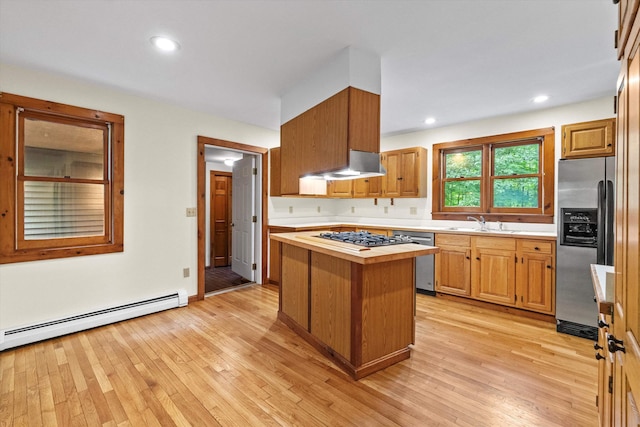147 Durham Point Rd, Durham, NH 03824 - kitchen with stainless steel appliances, ventilation hood, baseboard heating, light wood finished floors, and recessed lighting