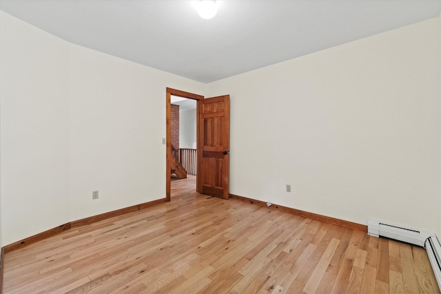 147 Durham Point Rd, Durham, NH 03824 - unfurnished room featuring light wood finished floors and a baseboard heating unit