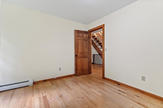 147 Durham Point Rd, Durham, NH 03824 - unfurnished room featuring radiator heating unit, light wood finished floors, and a baseboard heating unit