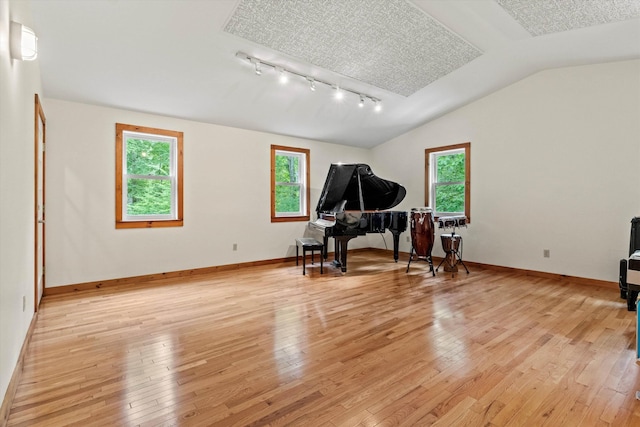 147 Durham Point Rd, Durham, NH 03824 - living area featuring plenty of natural light, track lighting, light wood finished floors, and lofted ceiling