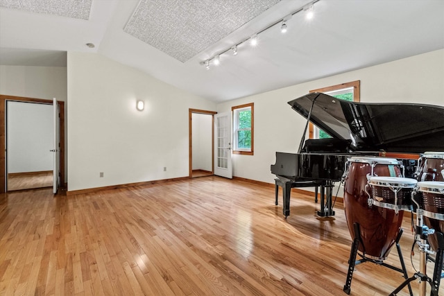 147 Durham Point Rd, Durham, NH 03824 - sitting room featuring lofted ceiling, rail lighting, and wood finished floors