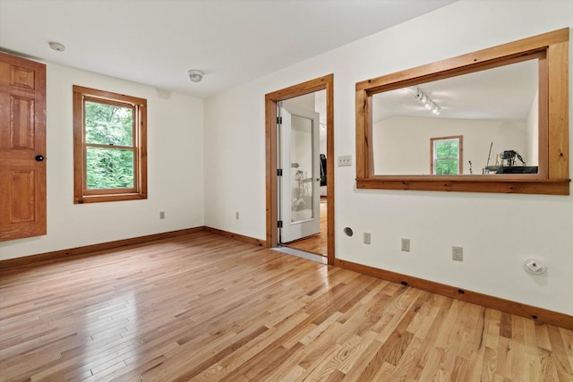 147 Durham Point Rd, Durham, NH 03824 - empty room with light wood-type flooring and a smoke detector