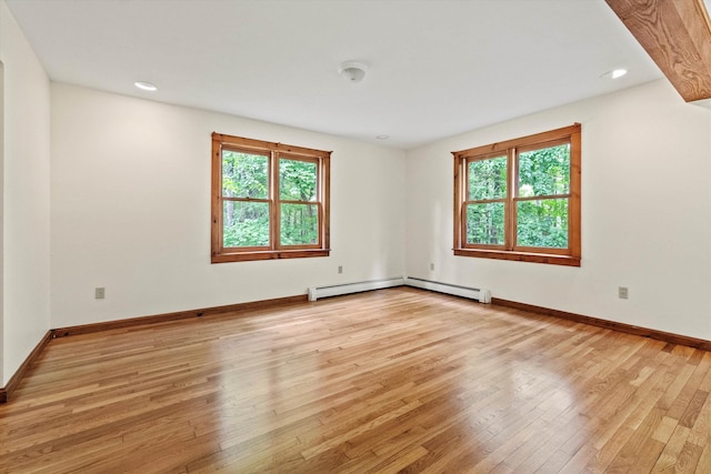 147 Durham Point Rd, Durham, NH 03824 - empty room featuring plenty of natural light, light wood finished floors, a baseboard radiator, and recessed lighting