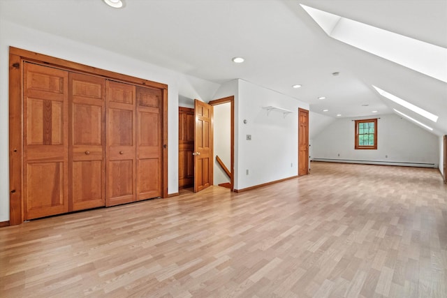 147 Durham Point Rd, Durham, NH 03824 - bonus room featuring a skylight, lofted ceiling, a baseboard heating unit, light wood-type flooring, and recessed lighting