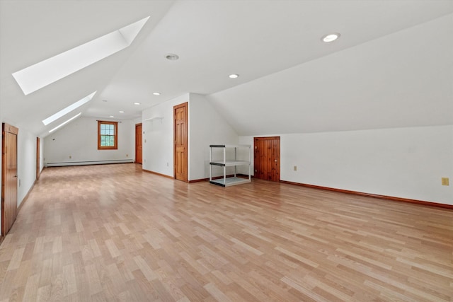 147 Durham Point Rd, Durham, NH 03824 - additional living space featuring a skylight, a baseboard heating unit, vaulted ceiling, light wood finished floors, and recessed lighting