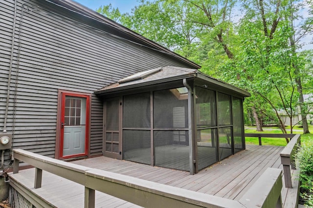 147 Durham Point Rd, Durham, NH 03824 - wooden deck with a sunroom