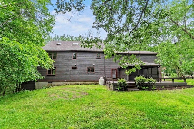 147 Durham Point Rd, Durham, NH 03824 - rear view of property with a deck, a sunroom, a lawn, and roof with shingles