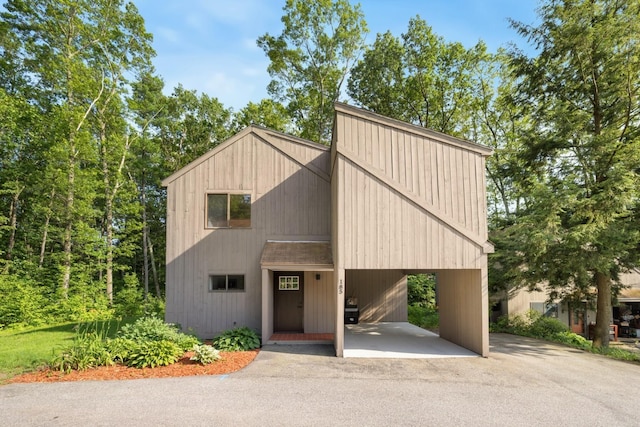 111 Coburn Ave Unit 185, Nashua, NH 03063 - view of front facade featuring driveway and a carport