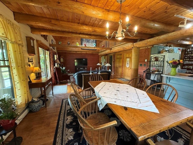 25 Rogers Way, Canaan, NH 03741 - dining area featuring dark wood-style flooring, a wooden ceiling with exposed beams, and a chandelier