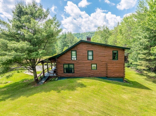25 Rogers Way, Canaan, NH 03741 - view of home's exterior featuring a chimney, a yard, and log siding