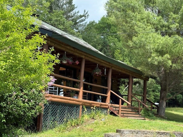 25 Rogers Way, Canaan, NH 03741 - back of property with log exterior and an exterior structure