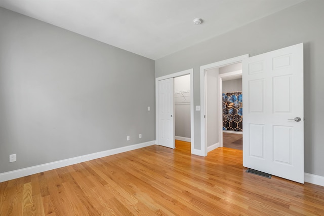 8C Villa Ln, Goffstown, NH 03045 - unfurnished bedroom featuring light wood-style flooring and a closet