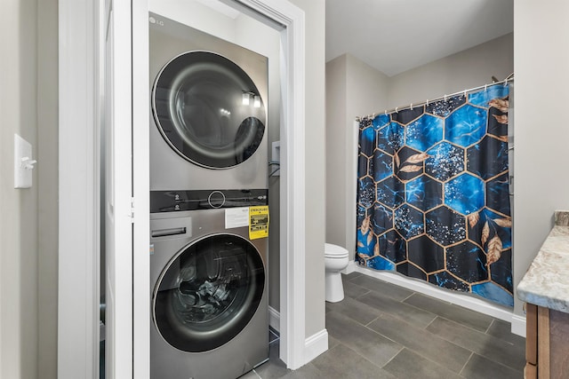 8C Villa Ln, Goffstown, NH 03045 - washroom with estacked washer and dryer and tile patterned floors