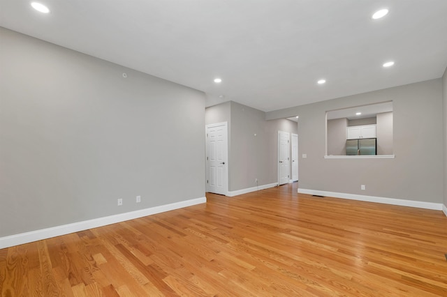 8C Villa Ln, Goffstown, NH 03045 - unfurnished room with light wood finished floors and recessed lighting