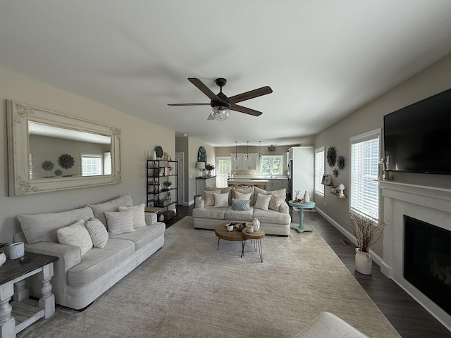 3800 Province Lake Rd, Wakefield, NH 03830 - living area featuring dark wood finished floors, ceiling fan, and plenty of natural light