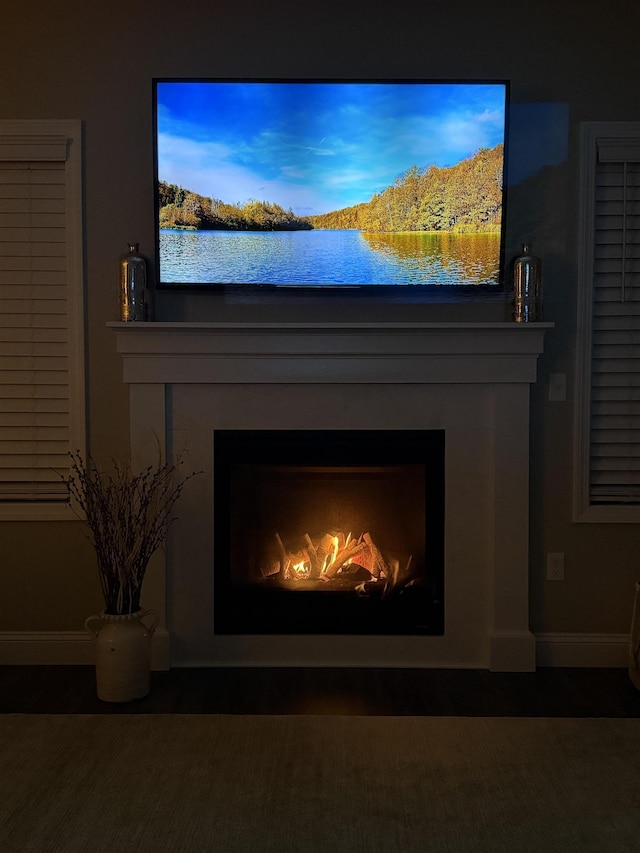 3800 Province Lake Rd, Wakefield, NH 03830 - detailed view of a lit fireplace and baseboards