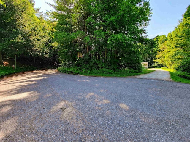 6 Cypress Ln, Essex, VT 05452 - view of asphalt road with a wooded view