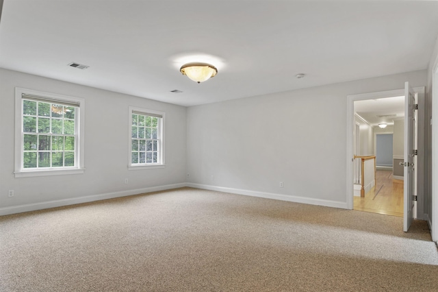 69 Exeter Rd, North Hampton, NH 03862 - empty room with light carpet and baseboards