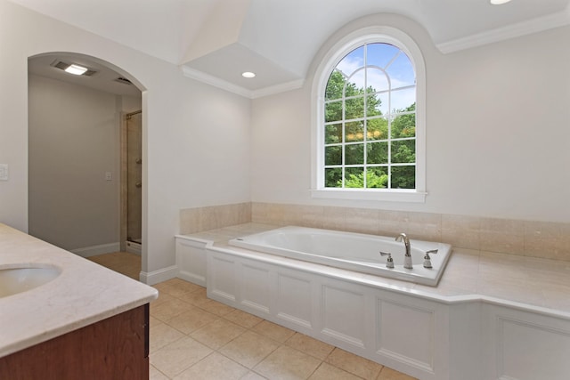69 Exeter Rd, North Hampton, NH 03862 - full bathroom with a garden tub, vanity, a shower stall, tile patterned flooring, and ornamental molding