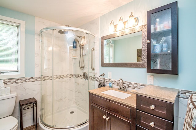 30 Thoreau Trl, Wakefield, NH 03830 - bathroom featuring tile walls, a stall shower, vanity, and decorative backsplash