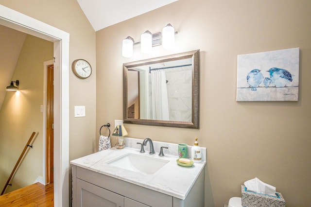 30 Thoreau Trl, Wakefield, NH 03830 - full bath with vanity, wood finished floors, curtained shower, and lofted ceiling