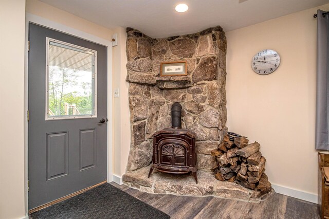 30 Thoreau Trl, Wakefield, NH 03830 - detailed view of a wood stove and wood finished floors