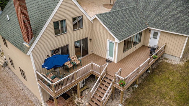 30 Thoreau Trl, Wakefield, NH 03830 - rear view of property featuring a chimney, a deck, a shingled roof, and stairs