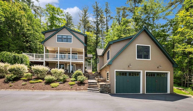 4 Quarry Rd, Sunapee, NH 03782 - view of front of house featuring stairway and asphalt driveway