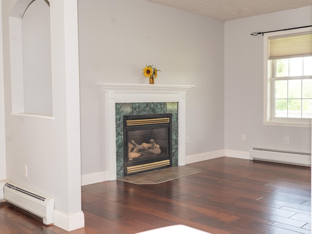 236 Cadieux Rd, Georgia, VT 05478 - unfurnished living room with a baseboard radiator, hardwood / wood-style floors, and a premium fireplace