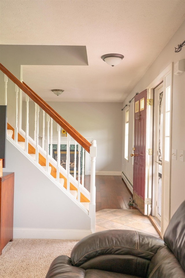 236 Cadieux Rd, Georgia, VT 05478 - entrance foyer with a baseboard heating unit and stairs