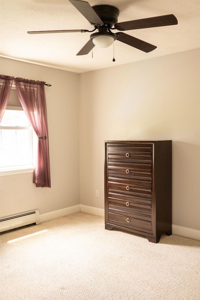 236 Cadieux Rd, Georgia, VT 05478 - unfurnished bedroom featuring a baseboard radiator, carpet flooring, and ceiling fan