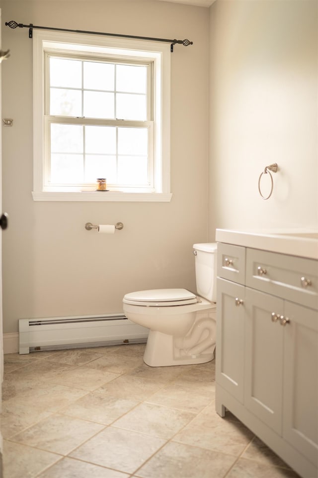 236 Cadieux Rd, Georgia, VT 05478 - bathroom featuring a baseboard radiator, plenty of natural light, vanity, and tile patterned flooring