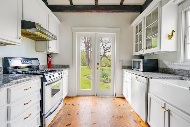 102 Hubbard Hill Rd, Rindge, NH 03461 - kitchen with appliances with stainless steel finishes, under cabinet range hood, light wood finished floors, glass insert cabinets, and white cabinets