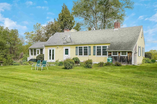 102 Hubbard Hill Rd, Rindge, NH 03461 - back of property with a chimney, a lawn, and roof with shingles