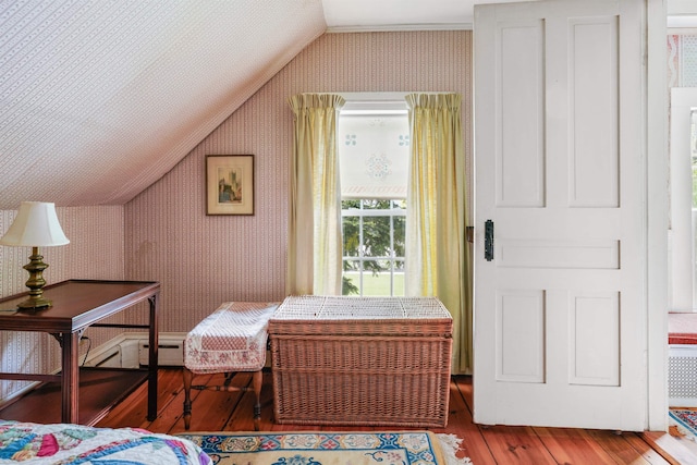 102 Hubbard Hill Rd, Rindge, NH 03461 - bedroom with vaulted ceiling, wallpapered walls, and hardwood / wood-style flooring
