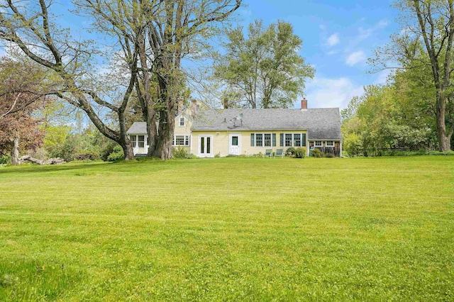 102 Hubbard Hill Rd, Rindge, NH 03461 - view of front of house with a front yard and a chimney