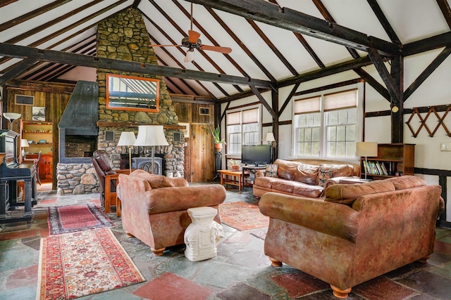102 Hubbard Hill Rd, Rindge, NH 03461 - living area featuring high vaulted ceiling, a fireplace, beam ceiling, a wood stove, and stone finish flooring