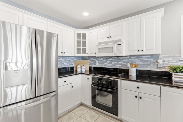 520 Ocean Blvd Unit 10, Hampton, NH 03842 - kitchen with black appliances, light tile patterned flooring, white cabinetry, decorative backsplash, and recessed lighting